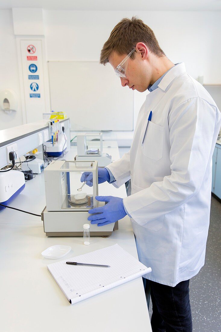 Chemistry students weighing chemicals