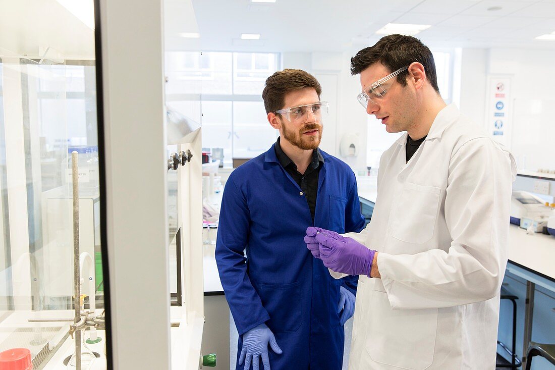 Chemistry students talking in lab