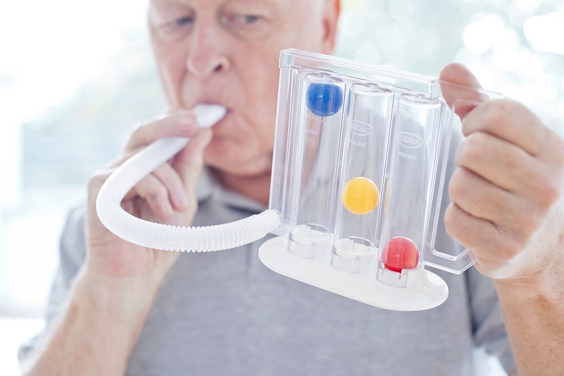Senior using incentive spirometer
