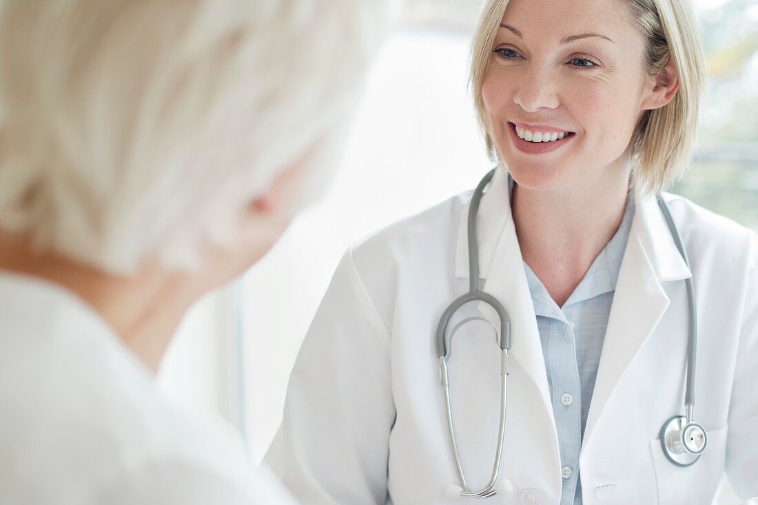 Female doctor smiling towards patient