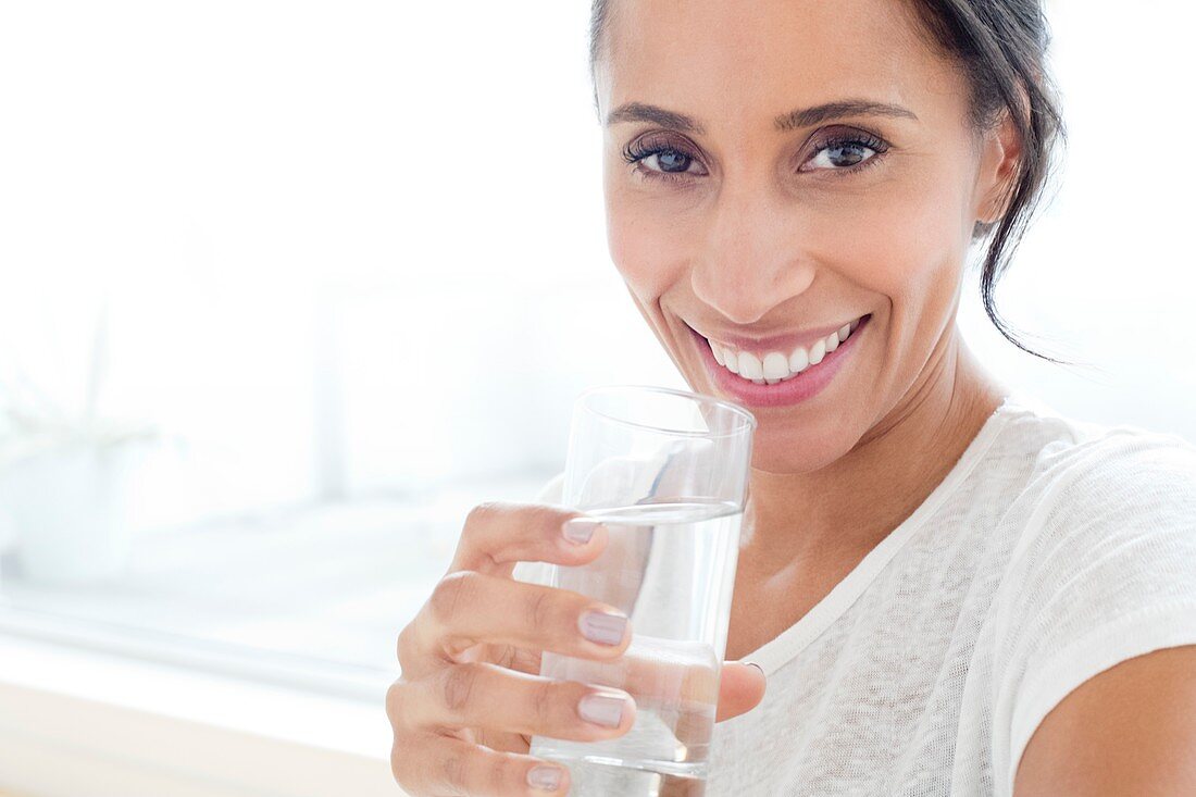 Woman with glass of water