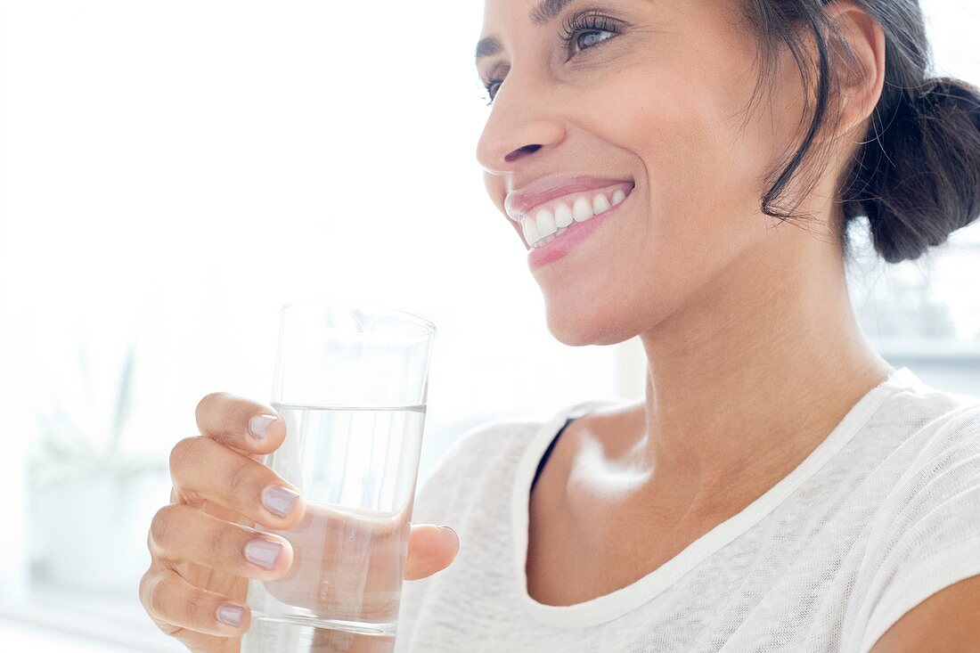 Woman with glass of water