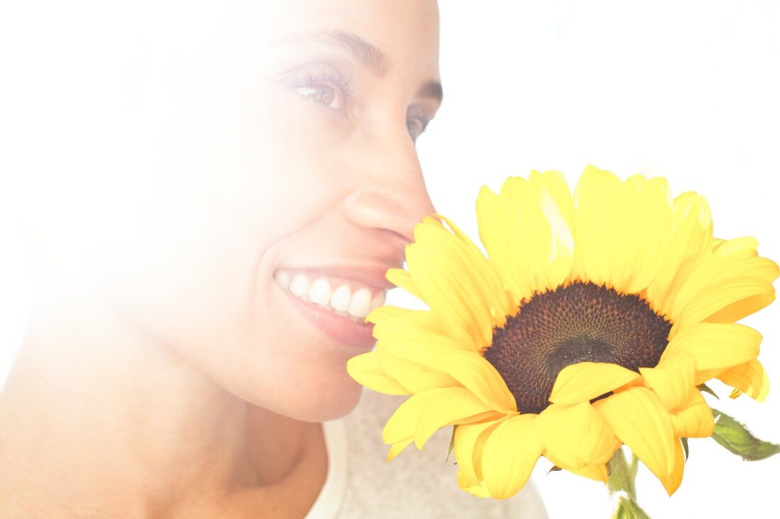 Woman holding sunflower