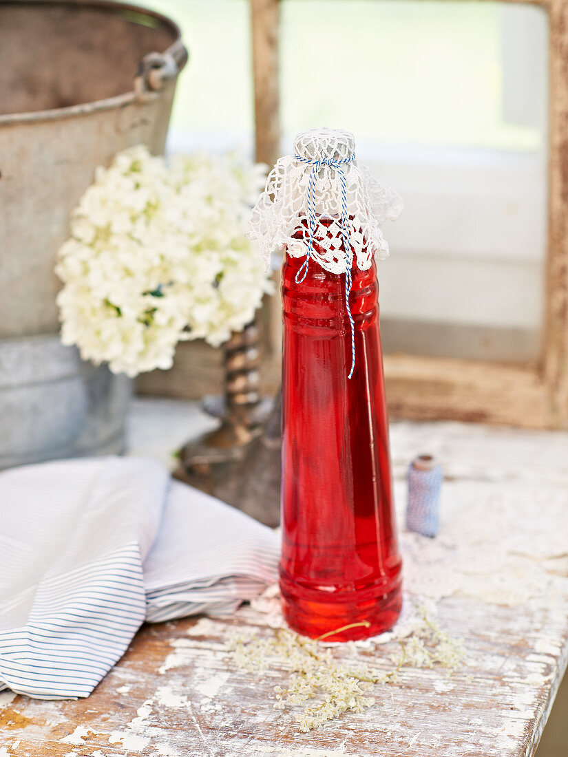 A bottle of homemade strawberry syrup