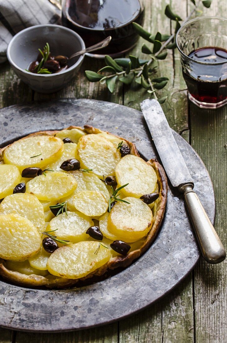 Potato tarte tatin with olives and rosemary