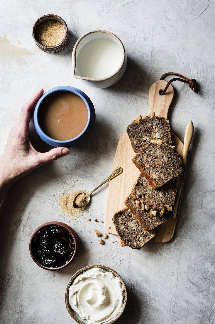 Slices of banana bread on a wooden chopping board for breakfast