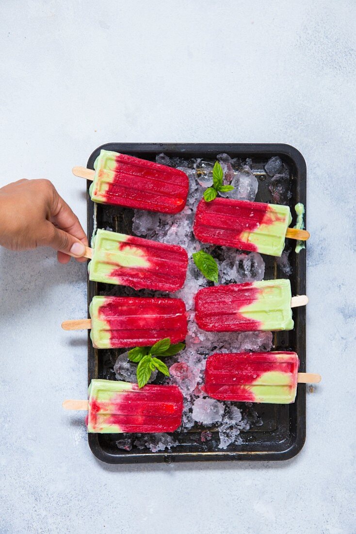 Homemade raspberry and matcha ice lollies with coconut (vegan)