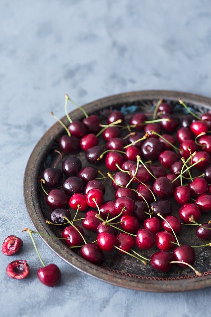 Fresh cherries on a metal tray