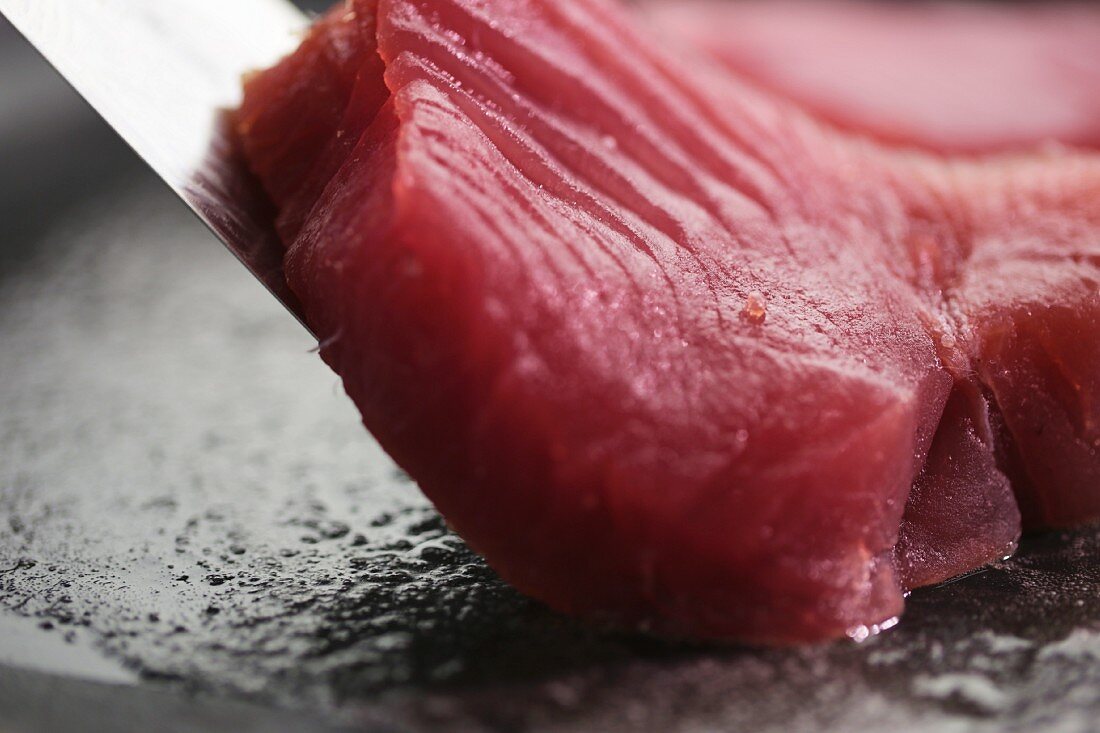 Tuna being fried (close-up)