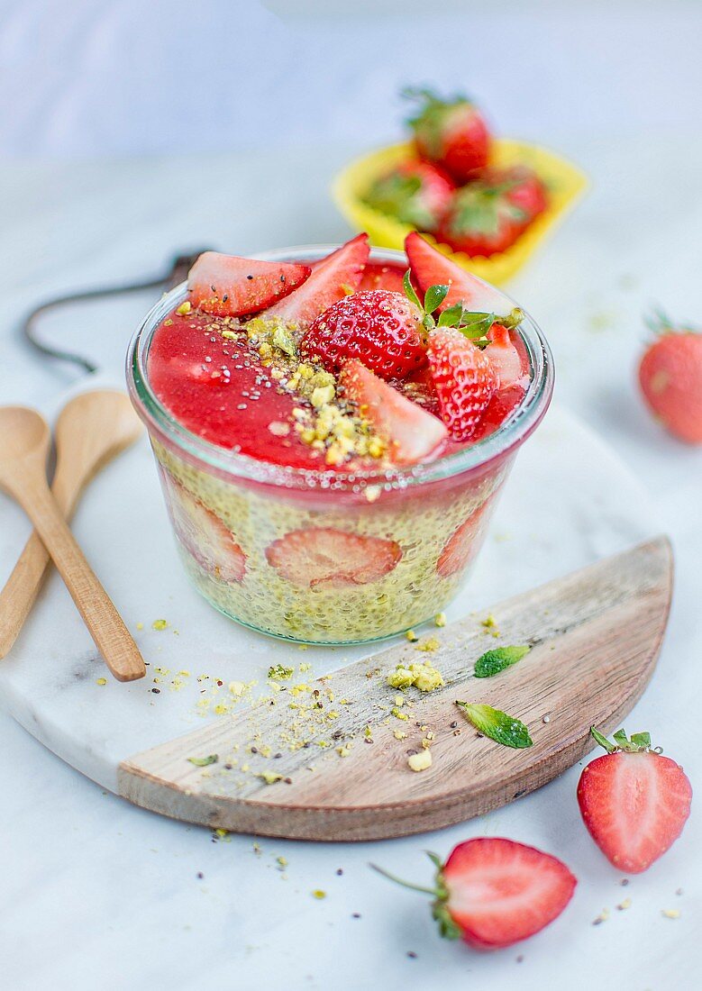Chia pudding with strawberries, mint and pistachios