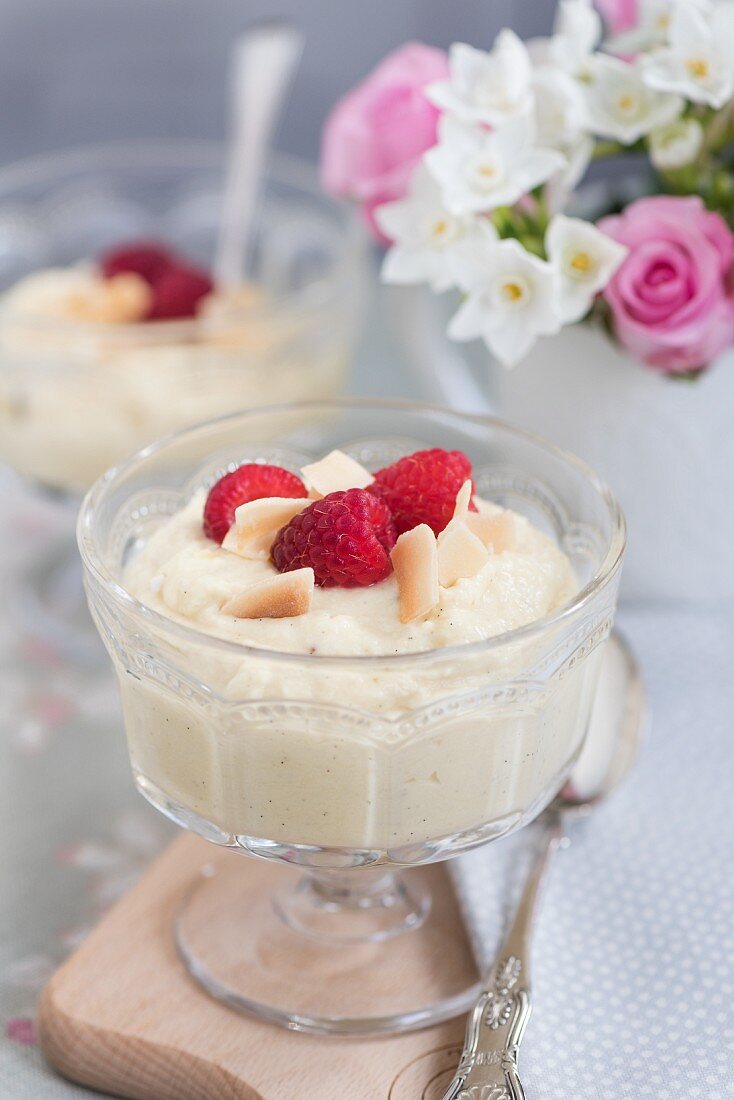 Pineapple and coconut cream with raspberries