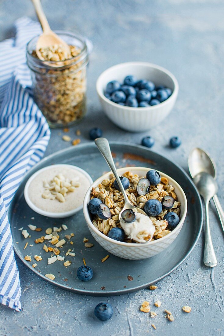 Granola with blueberries and peanut yoghurt