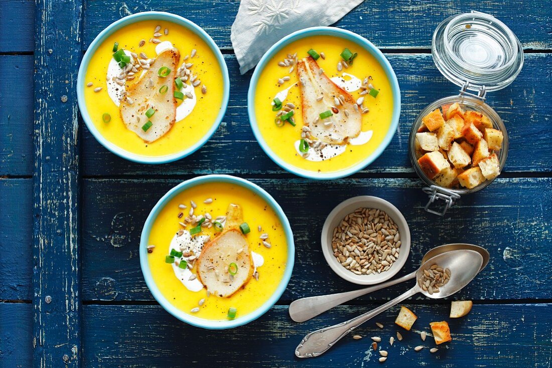 Pumpkin and pear cream soup with croutons