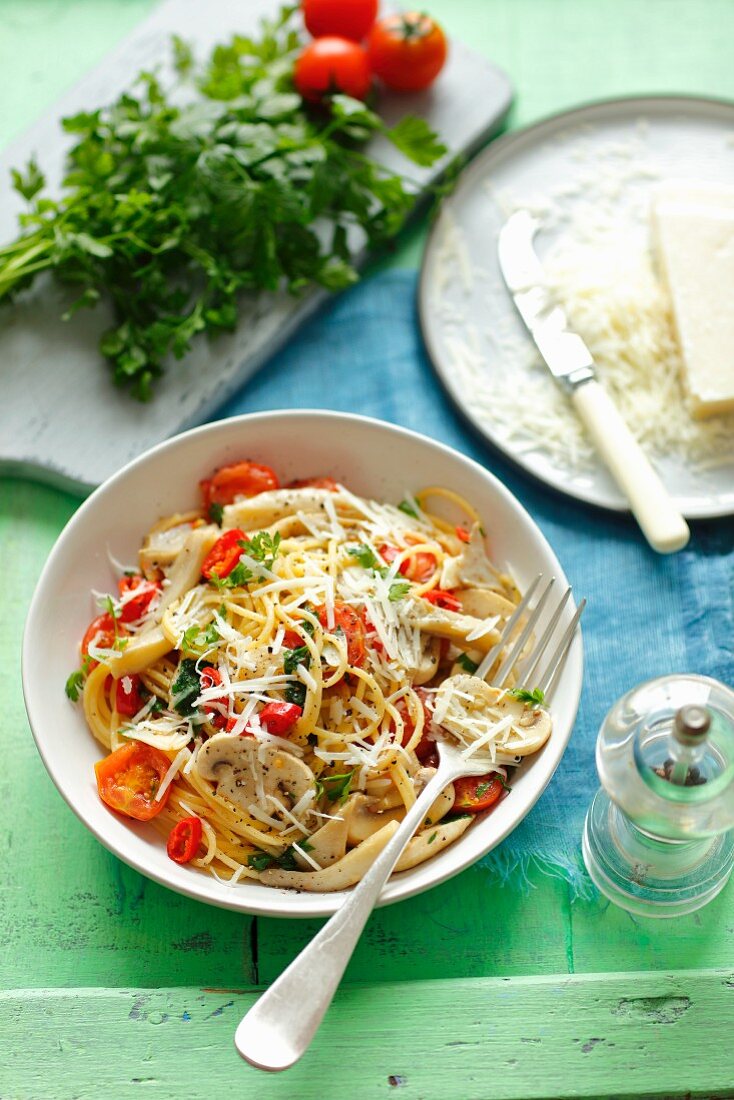 Spaghetti with oyster mushrooms, regular mushrooms and cherry tomatoes