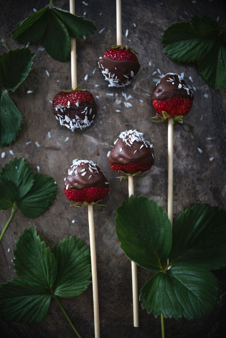 Dark chocolate-coated strawberries on sticks