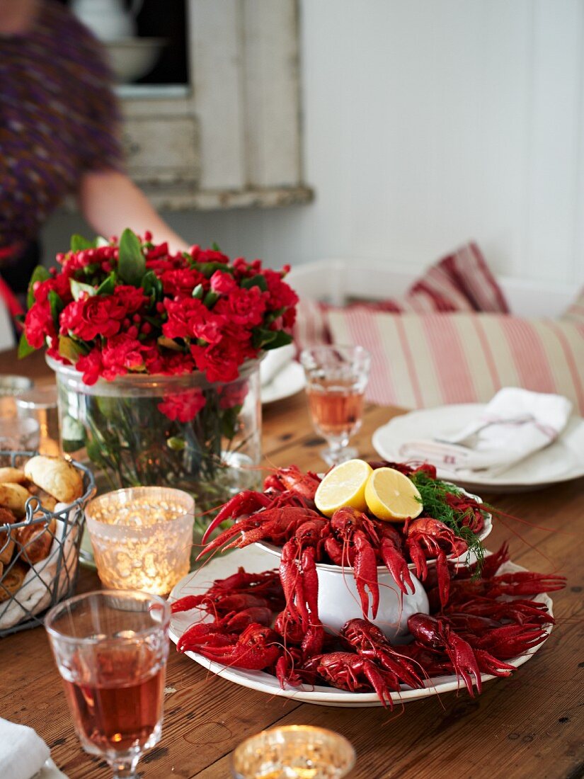 A table laid with crayfish and glasses of wine (Sweden)