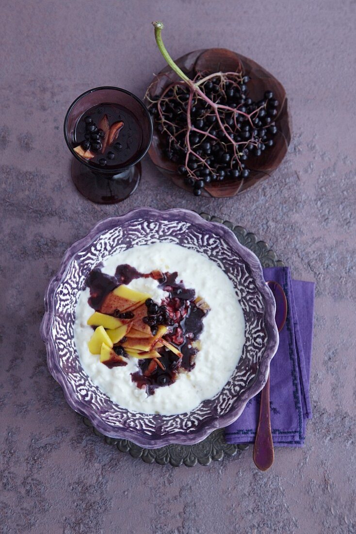 Rice pudding with elderberry sauce and mango