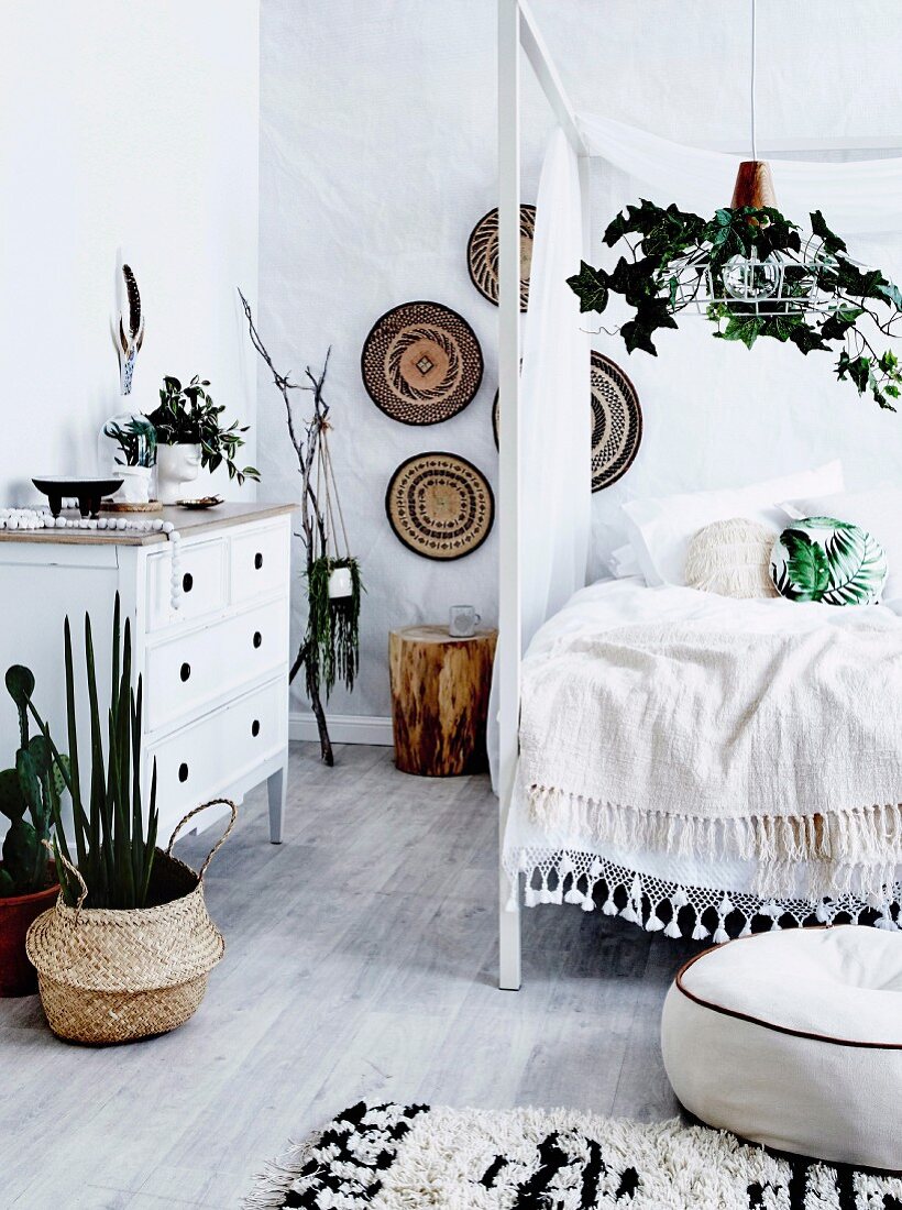 Boho bedroom in natural tones with house plants