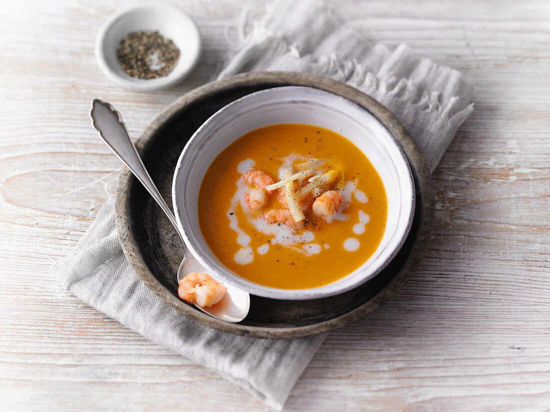 Thai pumpkin soup with coconut and prawns