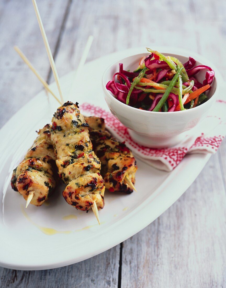 Chicken skewers with vegetable salad