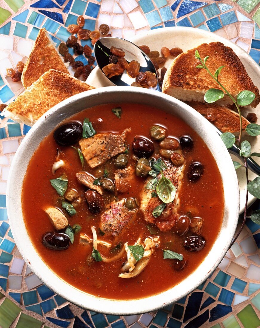 Capperata Siciliana (fish soup with tomatoes and olives, Italy)