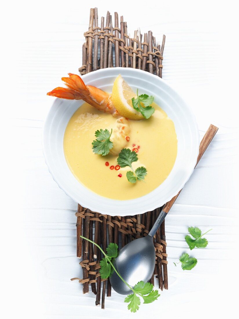 Prawn and curry soup with lemon and herbs