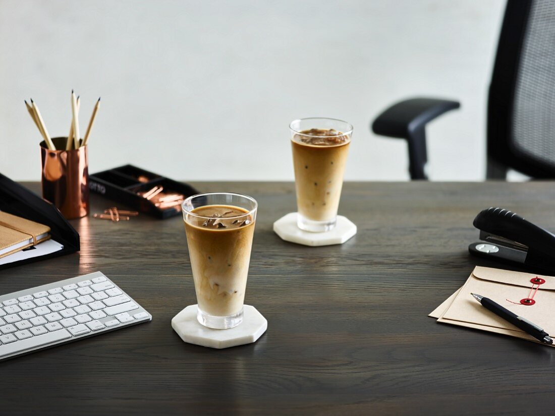 Iced coffee on a desk in an office