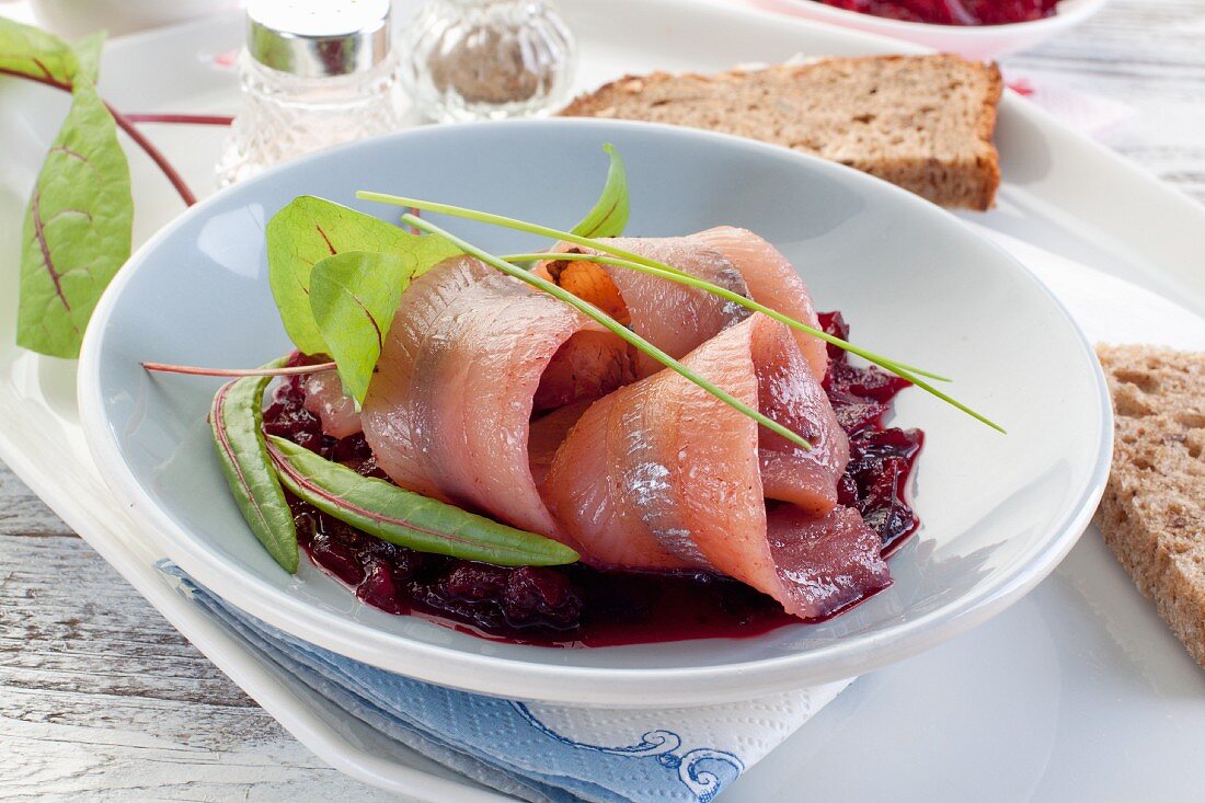 Marinated herring fillets with beetroot