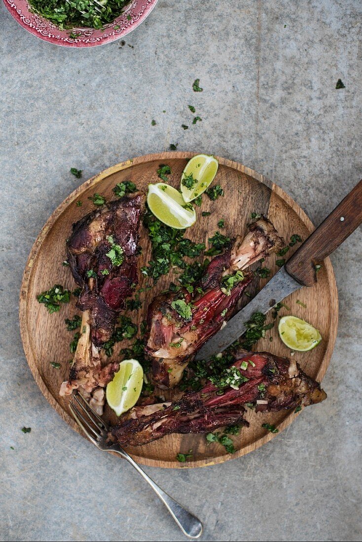 Roasted lamb shanks with peas, mint and lime