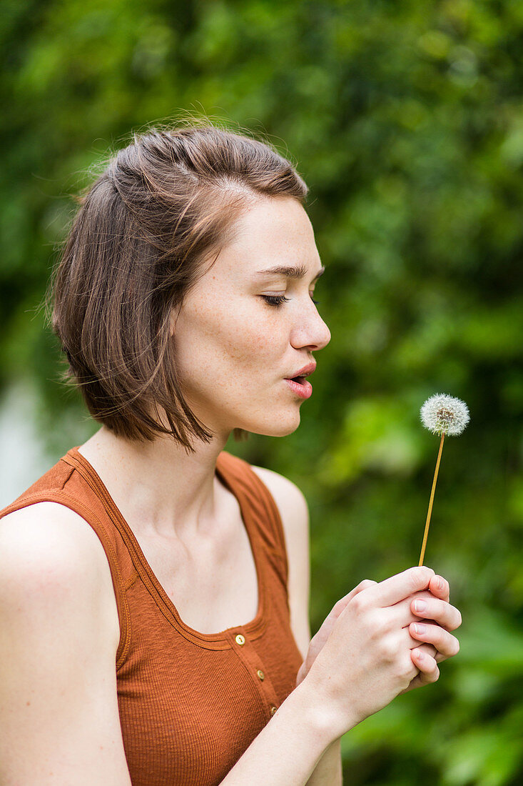 Woman and dandelion