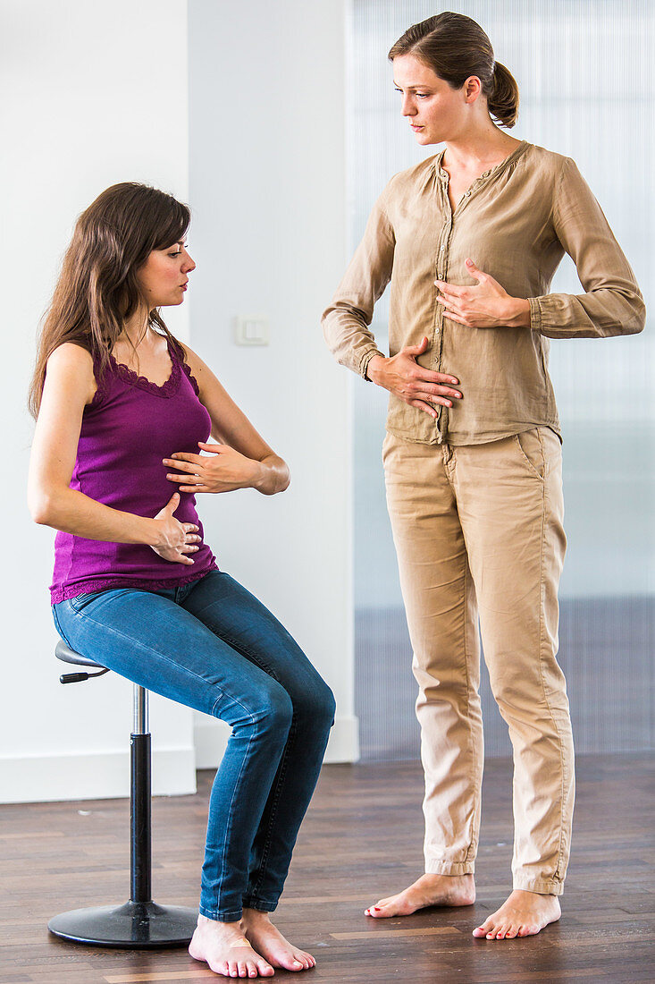 Woman practicing respiratory exercises