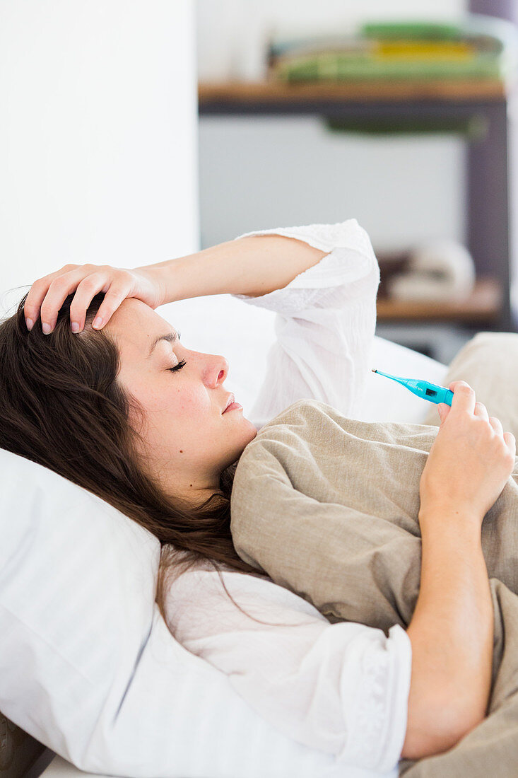 Woman checking her temperature