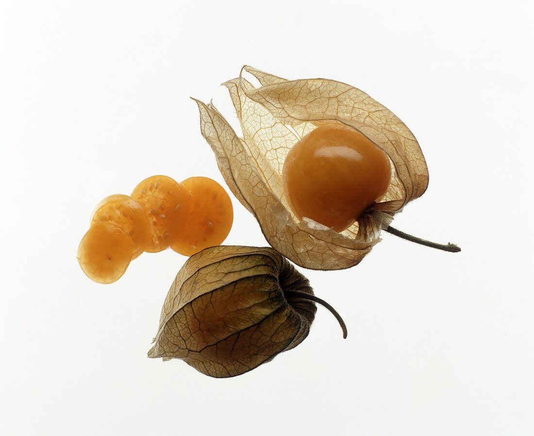 Two Whole Cape Gooseberries with a Sliced Cape Gooseberry
