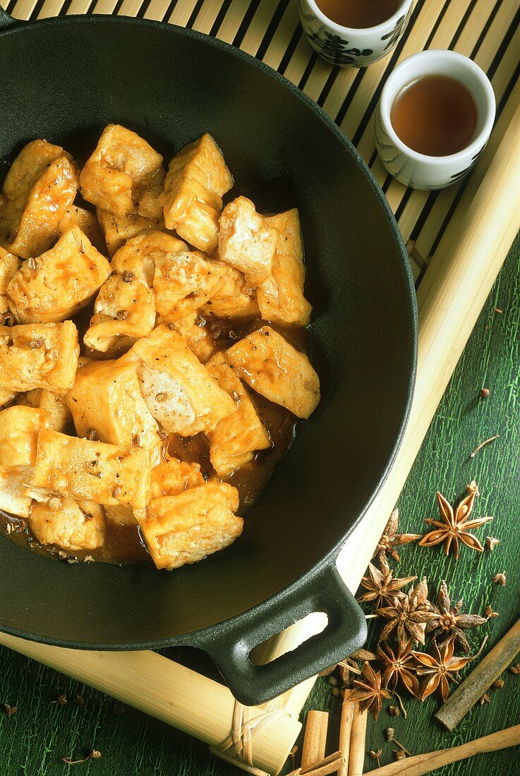Fried Tofu in a Wok with Sweet and Sour Sauce
