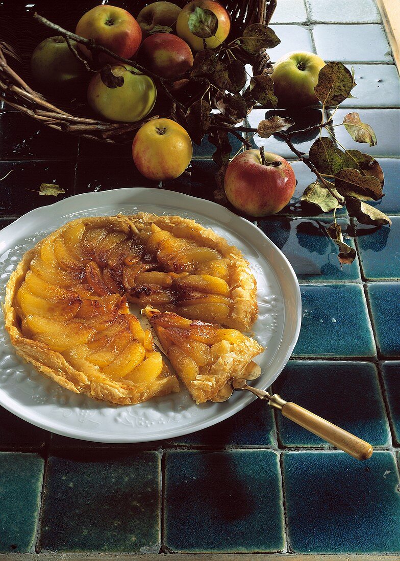 Apple tart with puff pastry, a piece cut