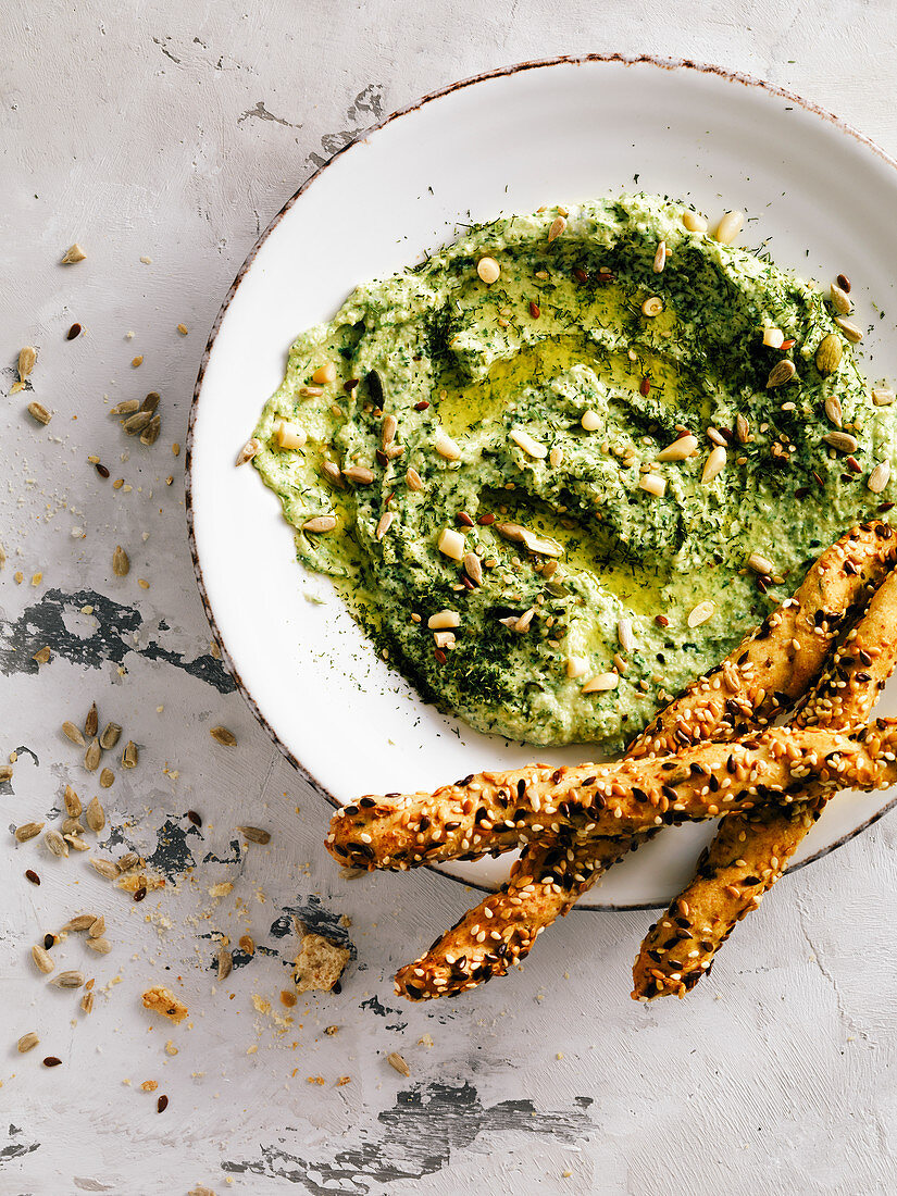 Hummus with spinach, dill and seeds.