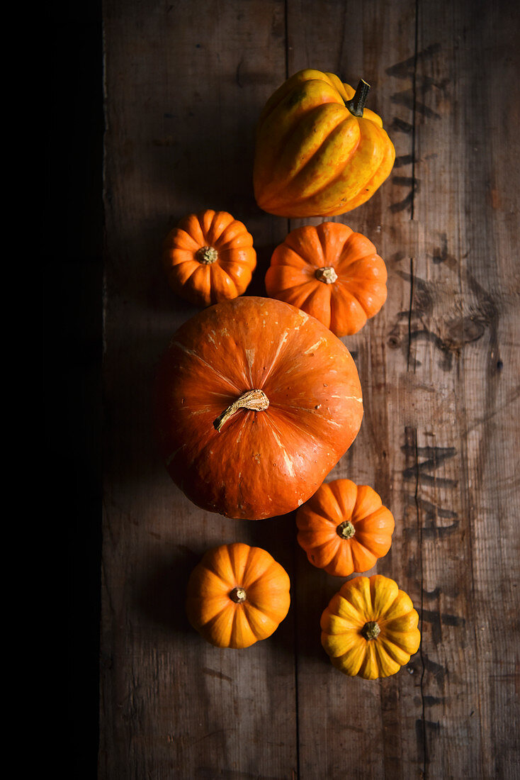 Orange pumpkins on a wooden crate