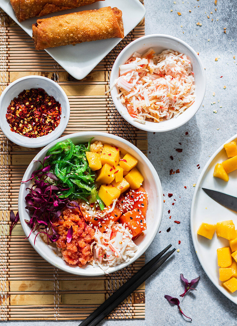 Poke Bowl with crabmeat, mango and sprouts fried egg rolls