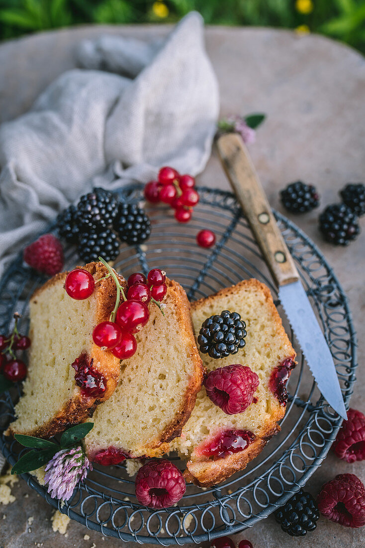 Summer cake with raspberries, blackberries and currants