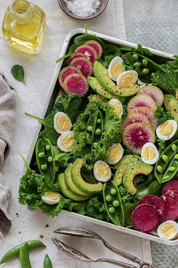 Green salad served in a tray on the table