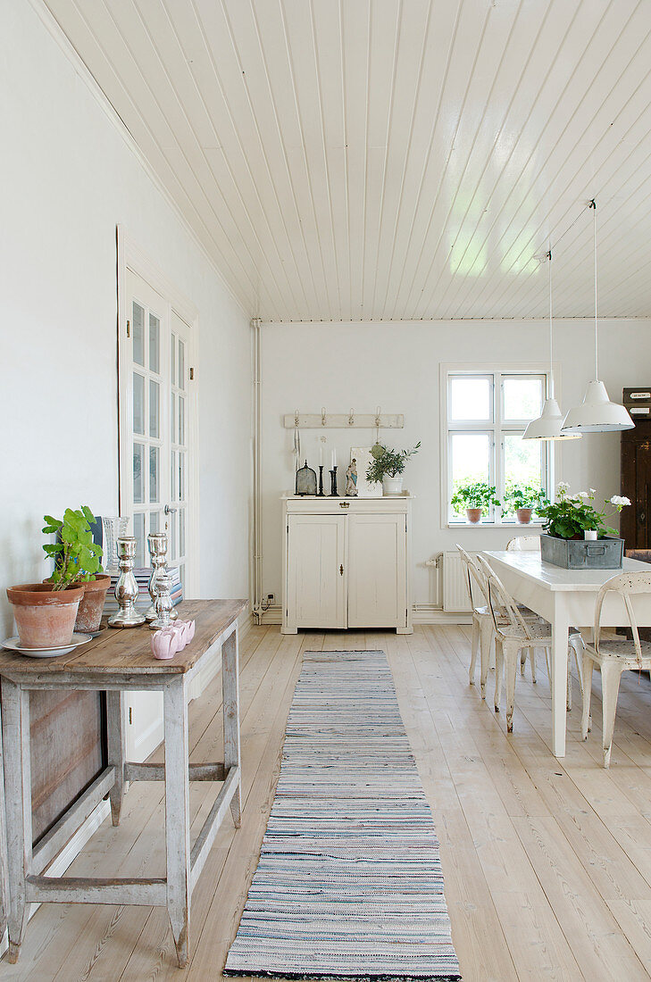 Long runner in a white Scandinavian style dining room