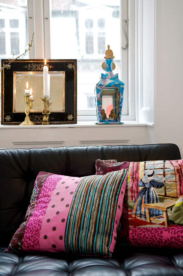 Colourful patchwork cushions with tapestry and pink fabric