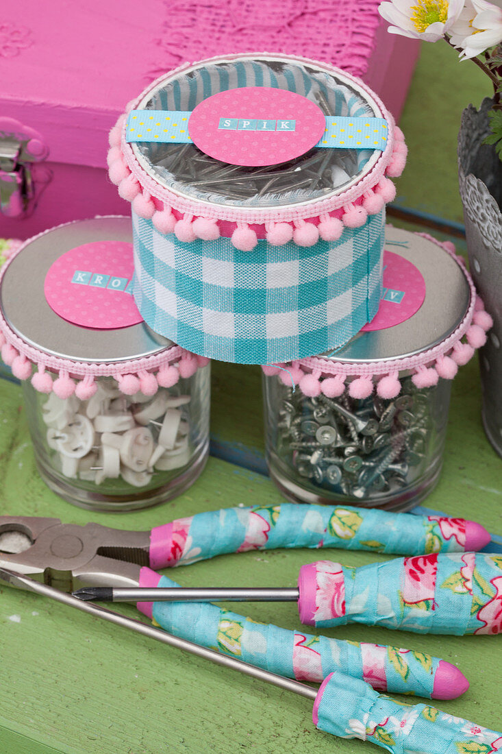 Jars decorated in feminine style and tools with floral decoupage