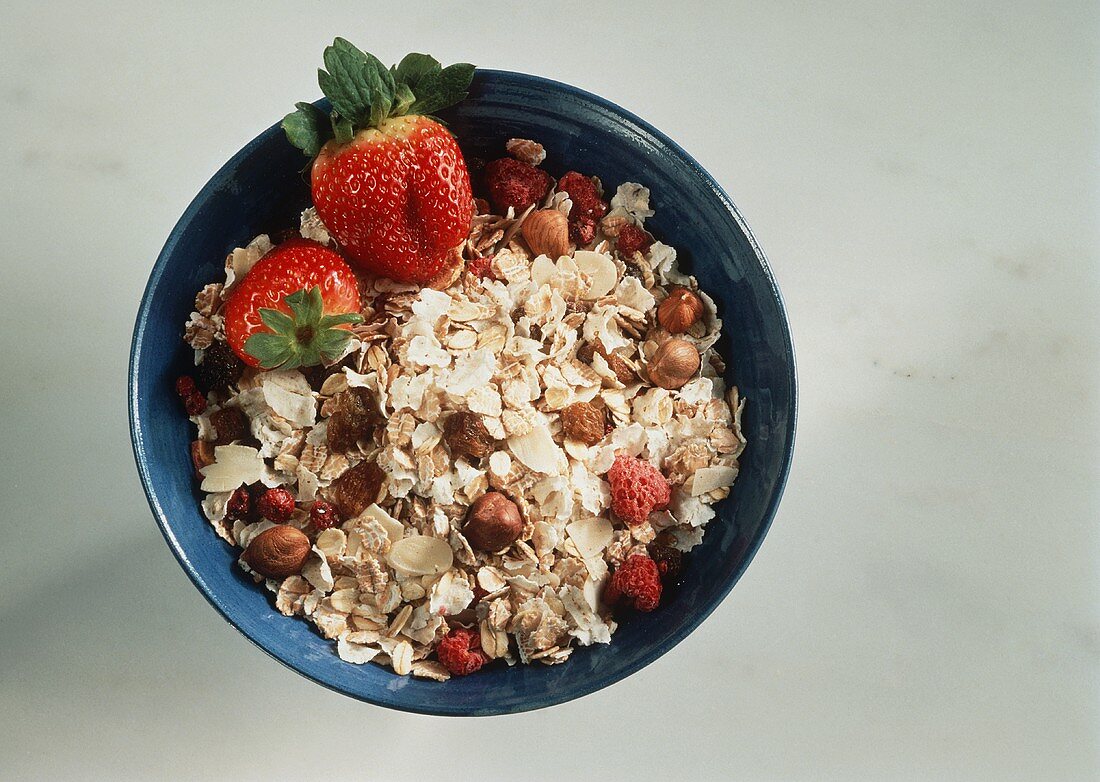 Oat muesli with raisins, nuts, almonds & strawberries