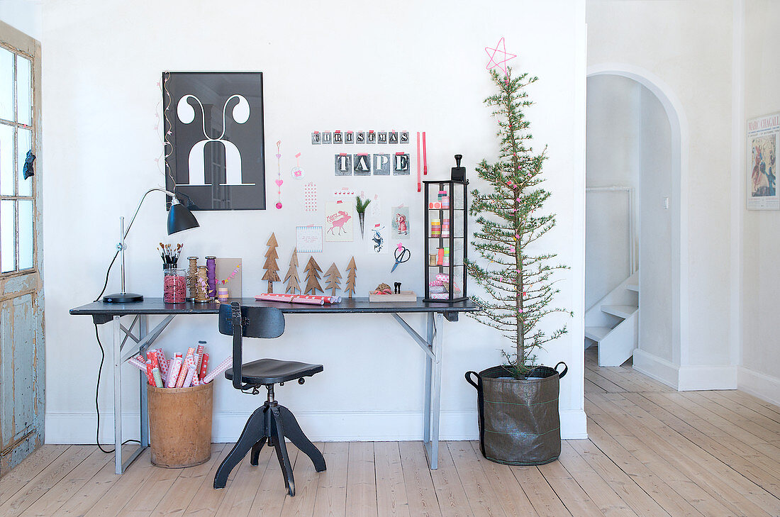A desk with hand made crafts and Christmas decorations