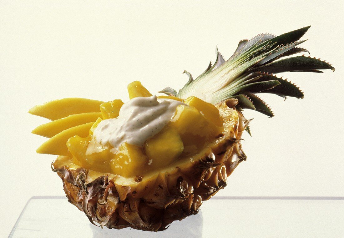 Mango and Pineapple with Cream Sauce in a Carved Pineapple