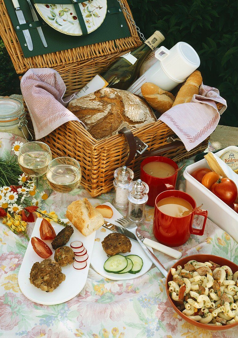 Picnic with a picnic basket, rissoles, pasta salad etc.