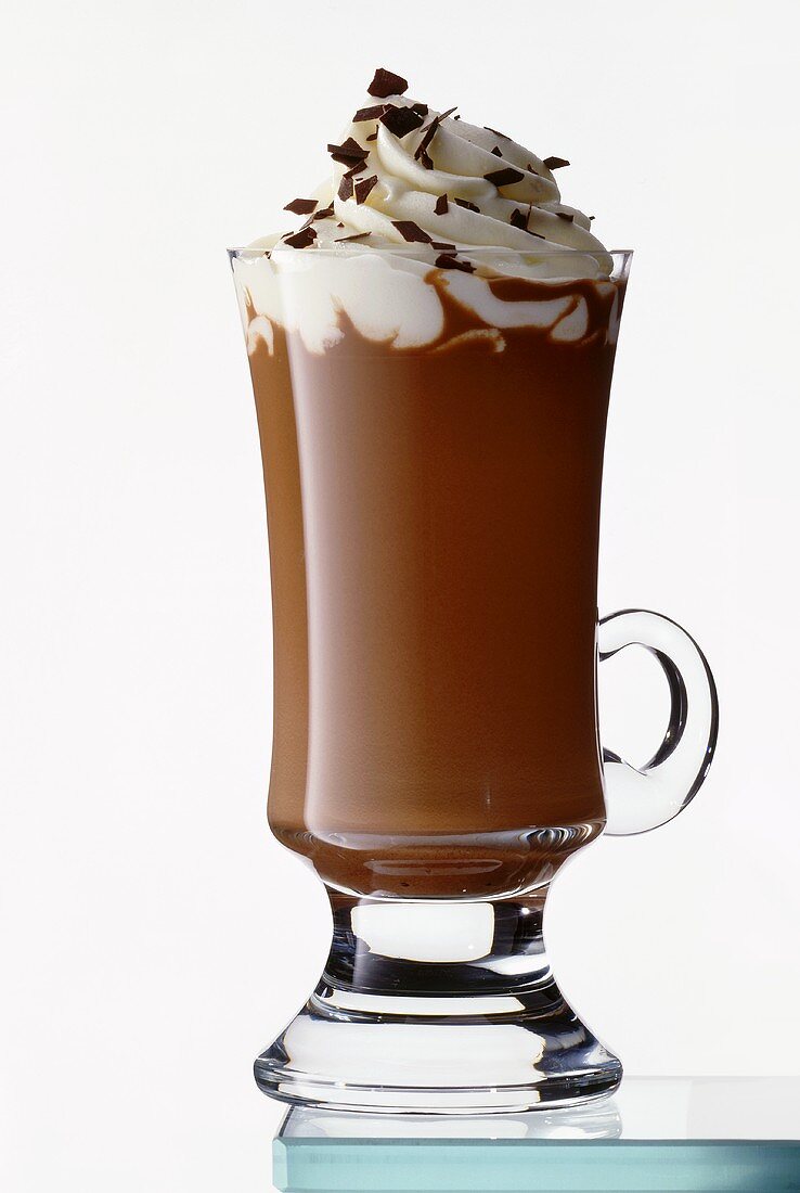 Hot chocolate with cream in tall glass
