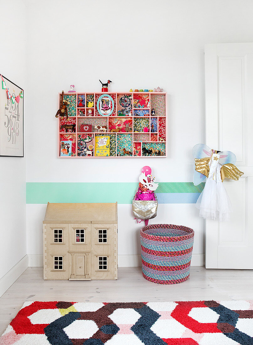 Typecase in a nursery lined with patterned paper