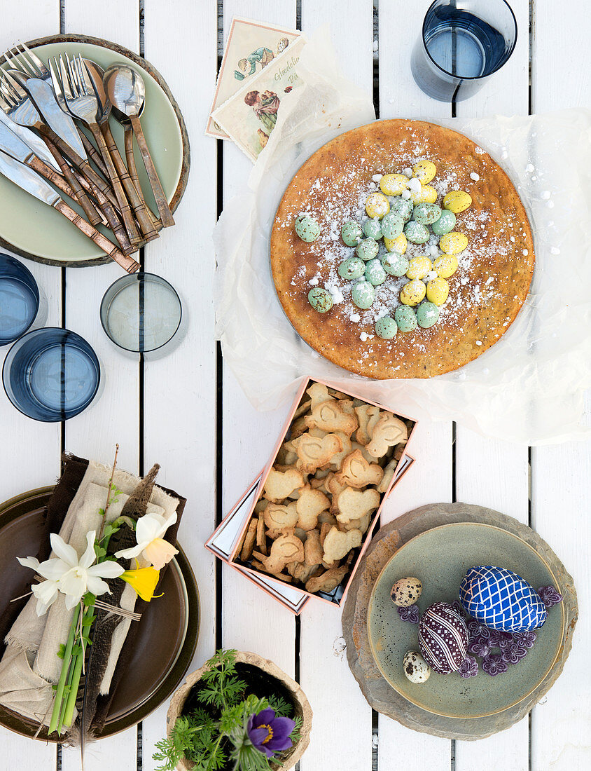 Rural Easter table with cake, sugar eggs, and cookies